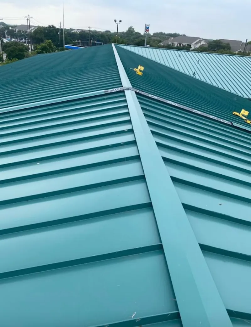 Green commercial metal roof ridge and valley for Metal Roof Repair in Northfield